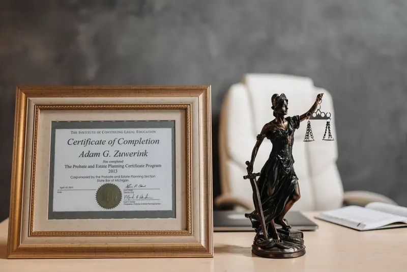 Framed university certificate with an embossed seal on an office desk