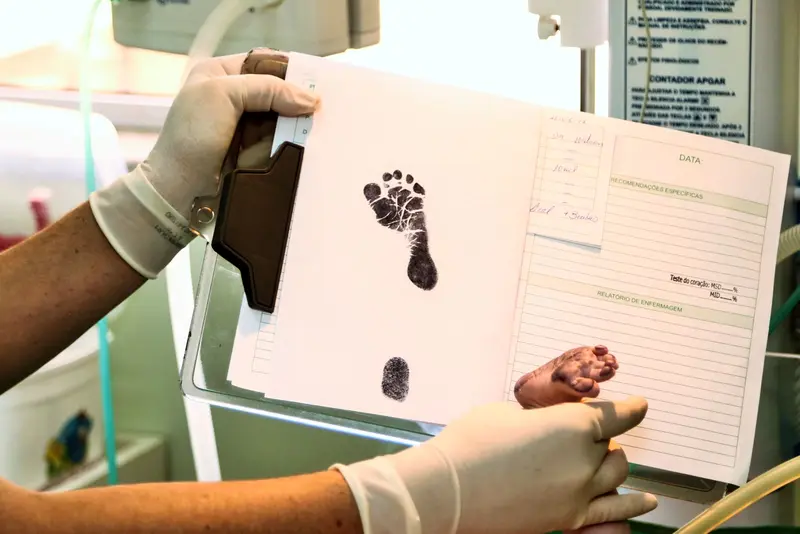 Newborn's footprint record being prepared in a hospital, the start of a birth certificate